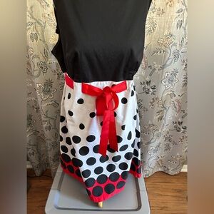 Black sleeveless top, Polka Dot Skirt with wide Red ribbon.